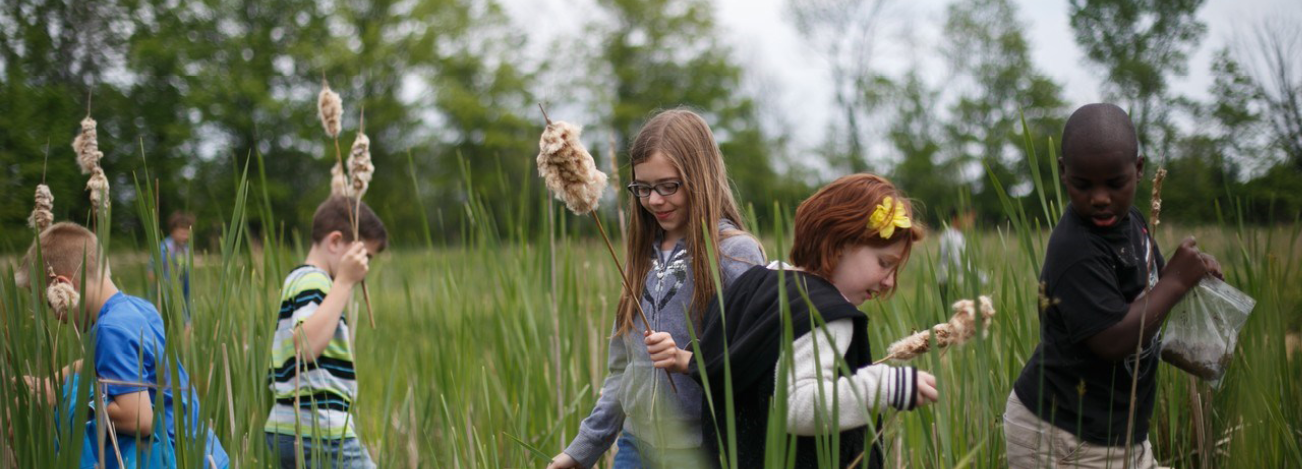 Header image of students learning in nature