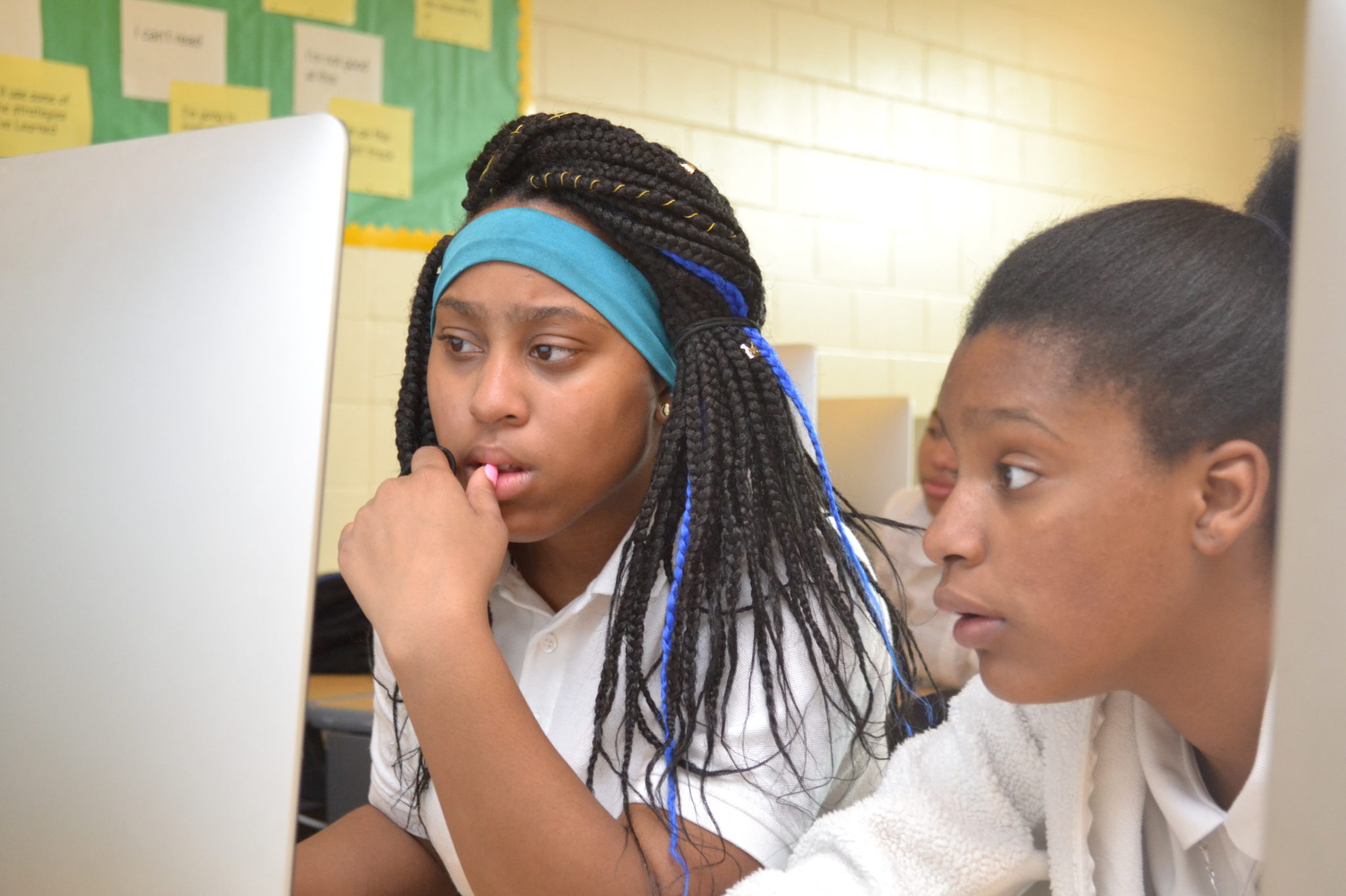 Jahnasia Robinson and Kenaysha Minter collaborate using the CODE.org Game Lab