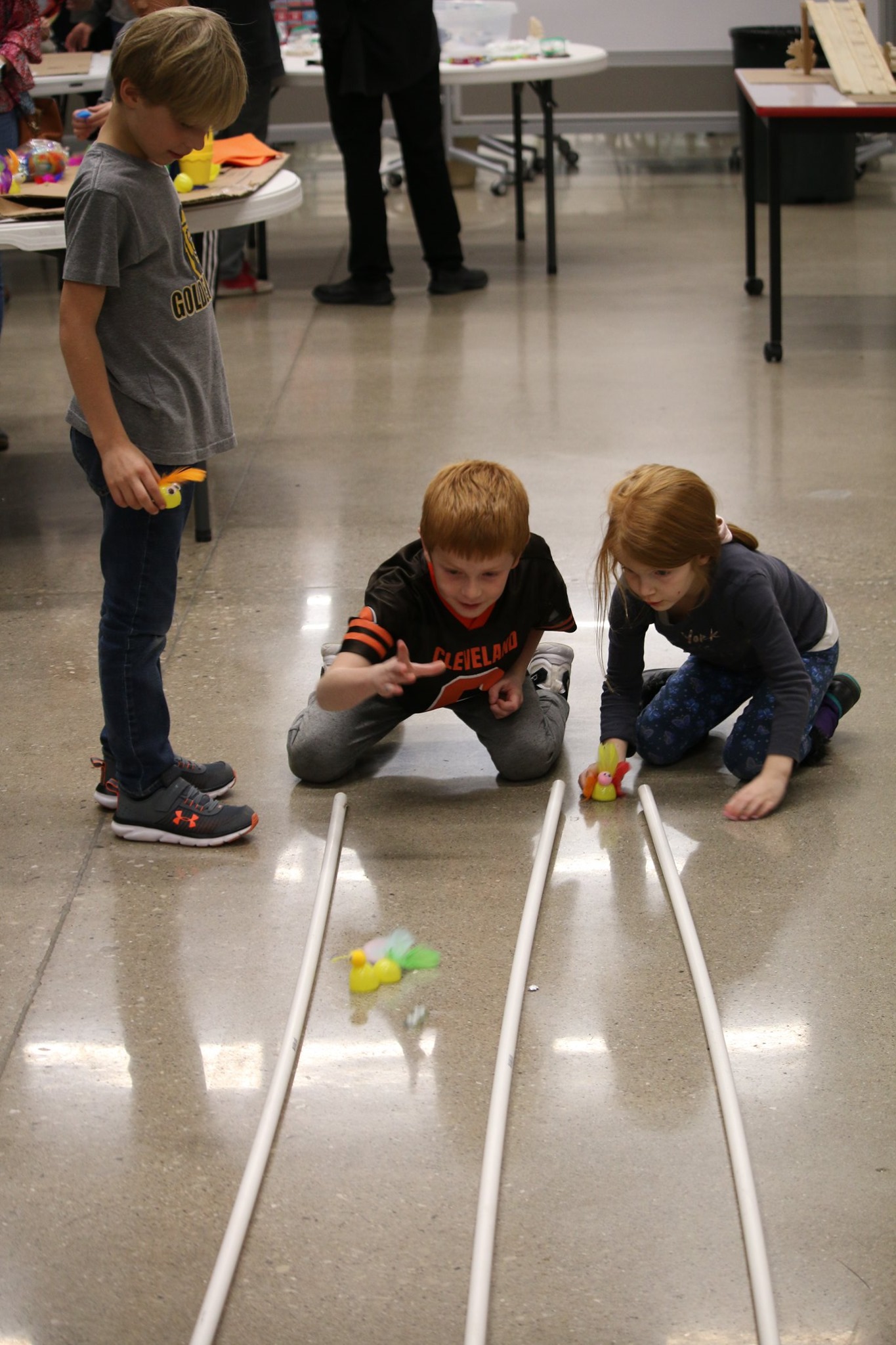 students racing cars at past foundation